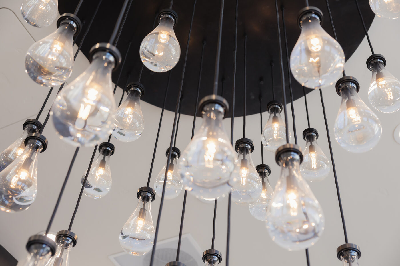 A close view of the chandelier over reception at Form + Function